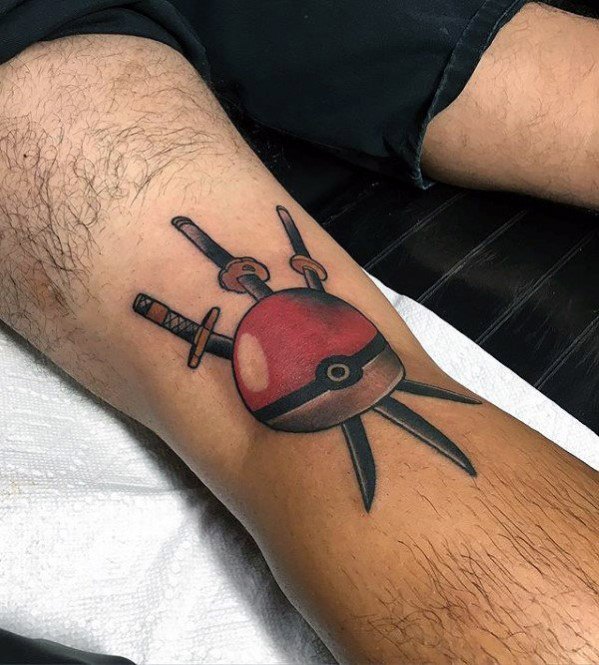 Unique Pokeball tattoo with crossed swords piercing through, blending Pokémon with a warrior or ninja-inspired theme on the leg.