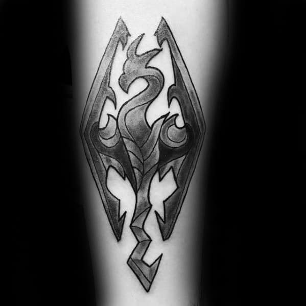 A Skyrim-inspired dragon emblem tattoo on skin