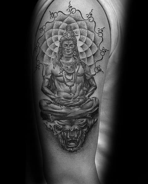 Tattoo of Lord Shiva meditating atop a lion's face, with a geometric mandala and Om symbol above, detailed with fine dotwork shading.