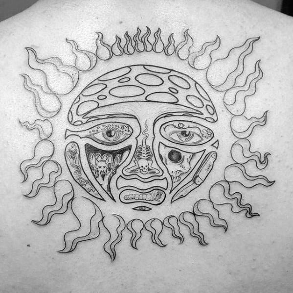 Black outline tattoo of the iconic Sublime sun face on the upper back, with detailed facial features and swirling flame rays.