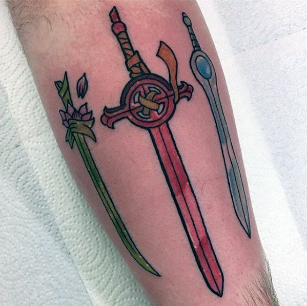 Adventure Time tattoo featuring three of Finn's iconic swords: the Root Sword, Demon Blood Sword, and Finn Sword, lined up on the calf.