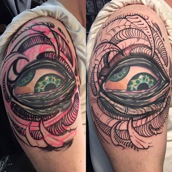 Tool-inspired upper arm tattoo featuring a vibrant green eye at the center, surrounded by swirling abstract black and pink linework.