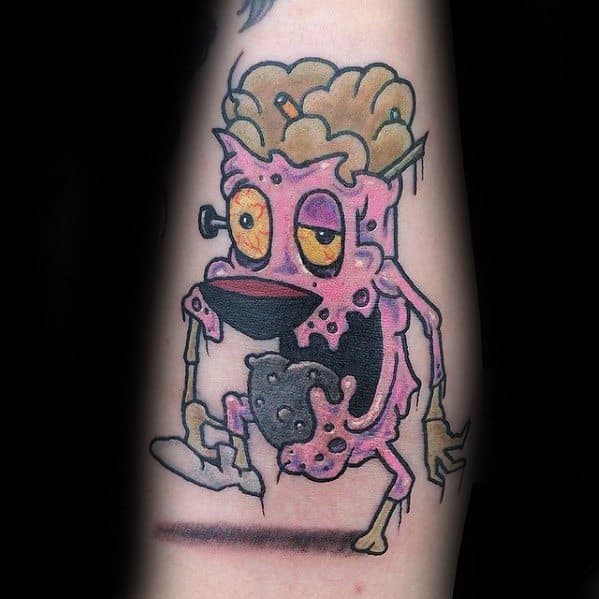 Zombie-style Courage the Cowardly Dog tattoo with exposed brain, droopy eyes, and decaying limbs, giving a creepy and cartoonish horror vibe.