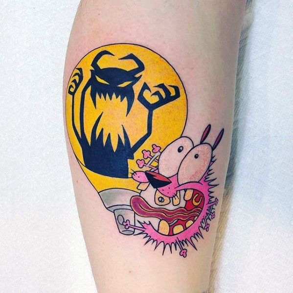 Courage the Cowardly Dog tattoo with a terrified expression, set against a large yellow moon and shadowy monster figure in the background.