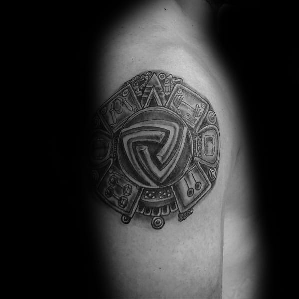 Intricate tribal-inspired shoulder tattoo with bold geometric patterns and shading, symbolizing strength, resilience, and cultural heritage.