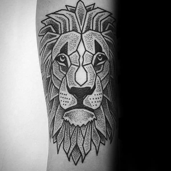 Black and grey Cubist-style lion tattoo with bold geometric shapes and dotwork shading, creating a fierce and symmetrical design.