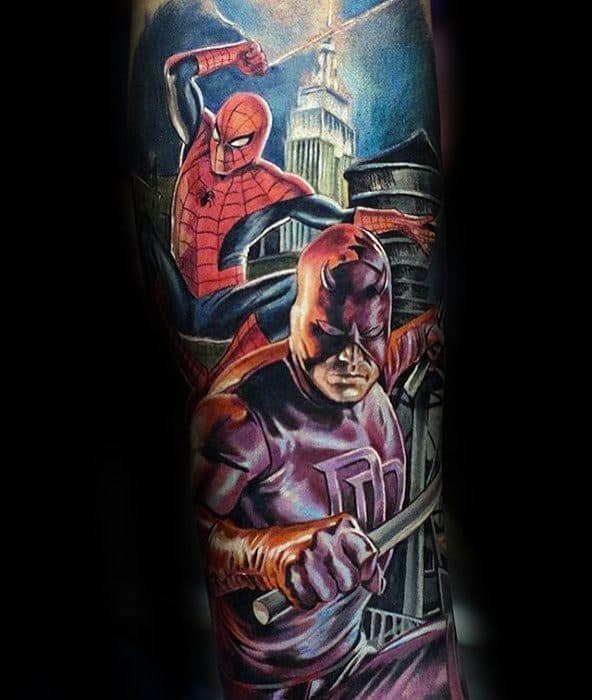 Vibrant tattoo of Daredevil and Spider-Man in action poses with a dramatic cityscape and glowing Empire State Building backdrop.
