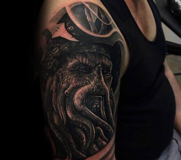 A Davy Jones-inspired octopus tattoo on a person's upper arm in a sleeveless shirt