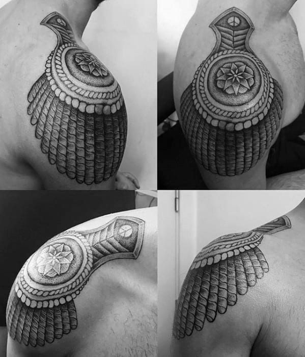 Symmetrical epaulette tattoo designs with floral mandala centers, layered scales, and bold ornamental patterns over the shoulder.