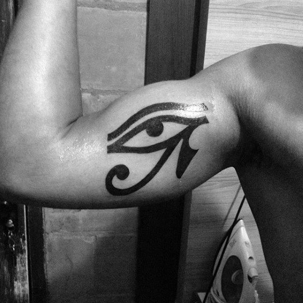 Arm with an Eye of Horus tattoo