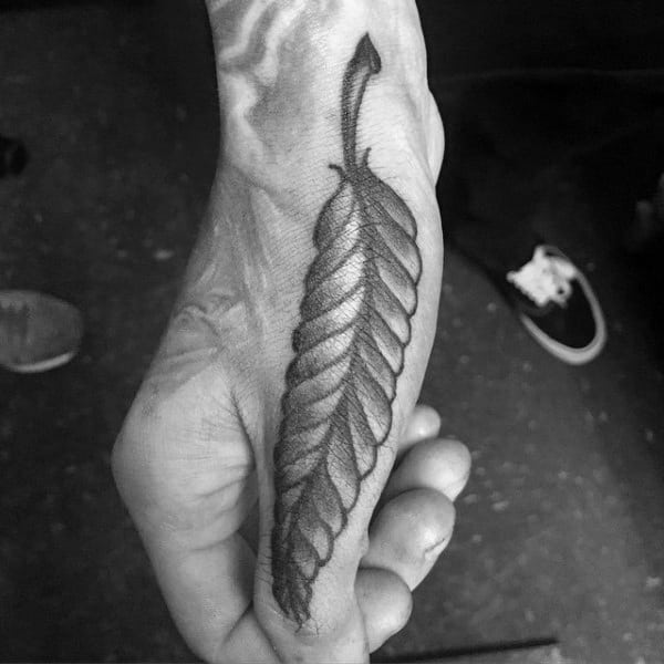 Male Feather Thumb Tattoos