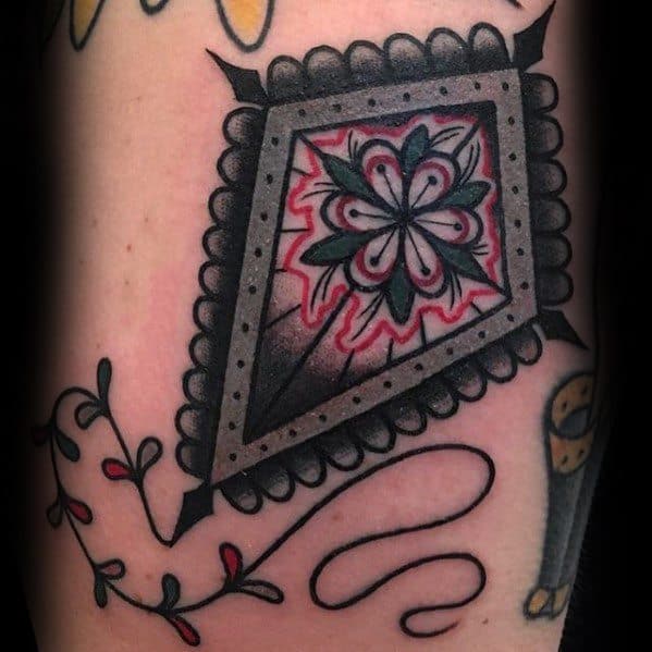 Male Floral Kite Tattoo Design Inspiration On Arm