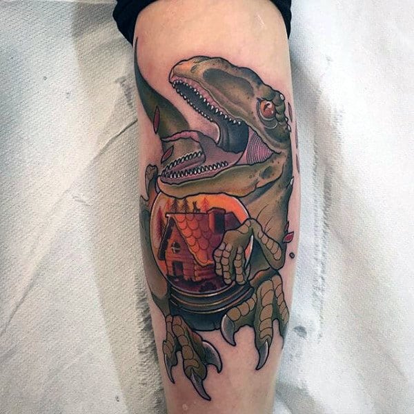 Male Forearms Green Dinosaur With Orange Sphere Tattoo