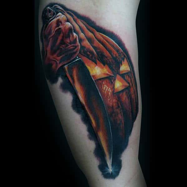 Male Forearms Halloween Pumpkin With Gleaming Sword Tattoo