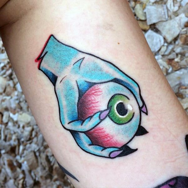 Male Forearms Hands Holding Eyeball Halloween Tattoo