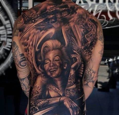 Male Full Back Sepia Colored Airplane And Smoking Lady Tattoo