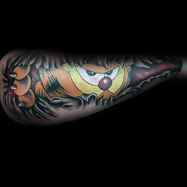 Realistic torn-skin Garfield tattoo with a fierce expression, creating a 3D effect—bold and intense design for a unique look.