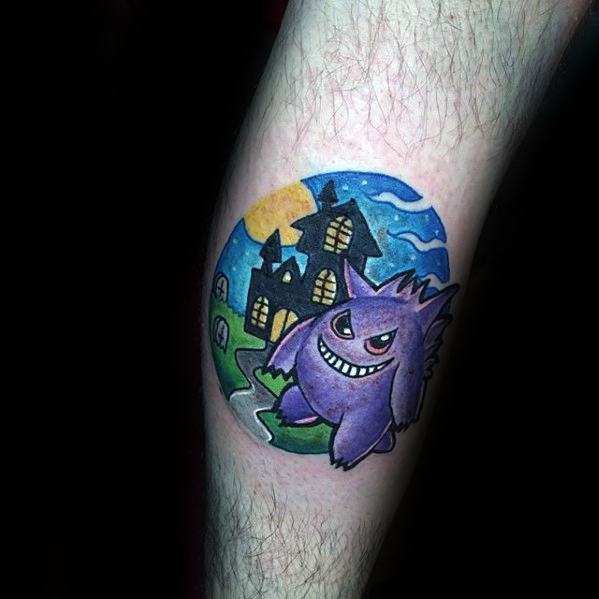 Whimsical Gengar tattoo with a spooky haunted house background, set under a full moon in a vibrant, storybook-style circle design.