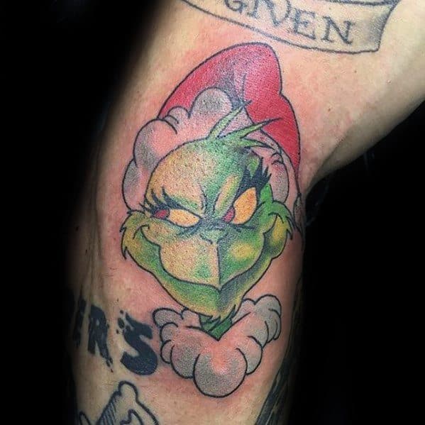 Grinch wearing a red Santa hat with a mischievous expression, surrounded by a puff of smoke, in vibrant green, red, and white hues, creating a playful tattoo design.