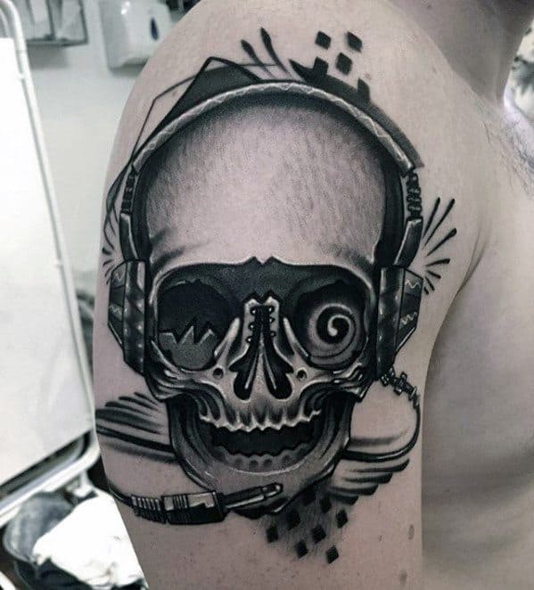 Male Headphones Tattoo Ideas With Skull Design On Arm