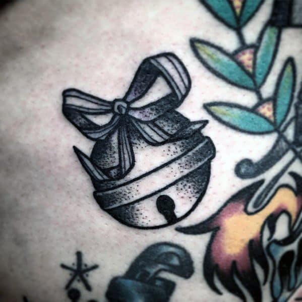 Black and grey Christmas tattoo of a jingle bell tied with a ribbon, featuring fine dotwork shading for a classic and festive holiday design.