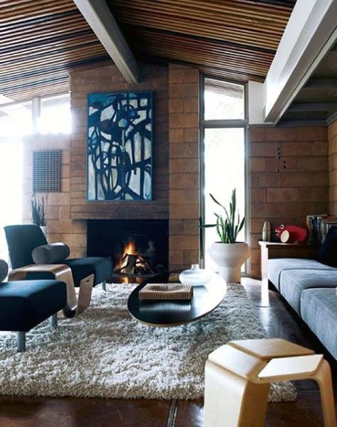 Elegant living room with fireplace, abstract artwork, and modern furniture design.