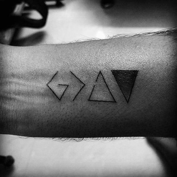 Forearm tattoo featuring the "God is greater than the highs and lows" symbol with geometric triangle elements
