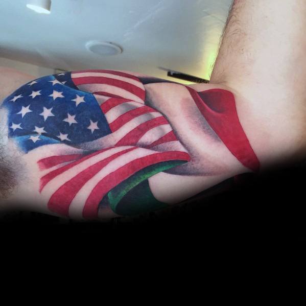 Bicep tattoo featuring the American and Italian flags intertwined, symbolizing dual heritage, patriotism, and cultural pride.