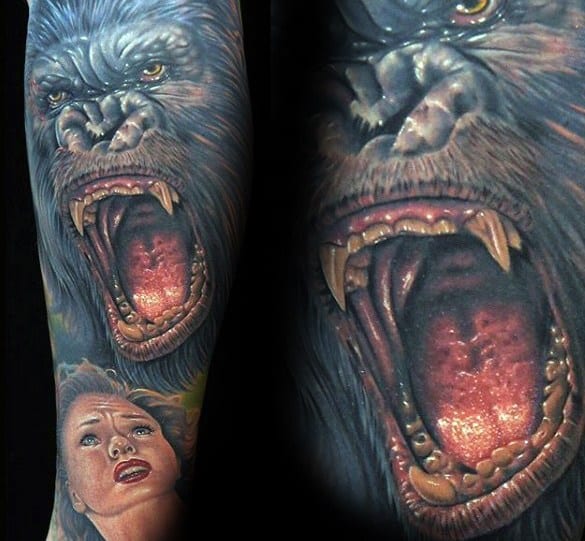 Realistic full-color King Kong tattoo sleeve featuring a roaring Kong with sharp teeth and a detailed woman’s portrait at the bottom.