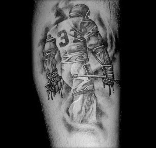Realistic black and grey lacrosse tattoo featuring a detailed player in full gear, holding a stick with dramatic shading for a bold effect.