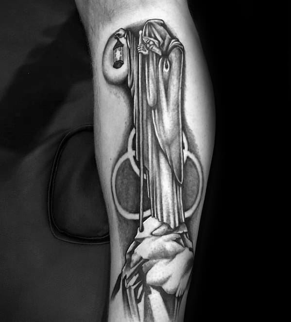 Black and gray tattoo of Led Zeppelin’s hooded hermit holding a lantern, standing on a rock, with the Borromean rings symbol in the background.