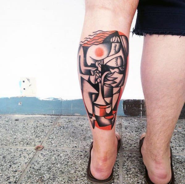 Cubist tattoo on the calf featuring an abstract female figure with flowing red hair, bold black outlines, and red-orange geometric accents.