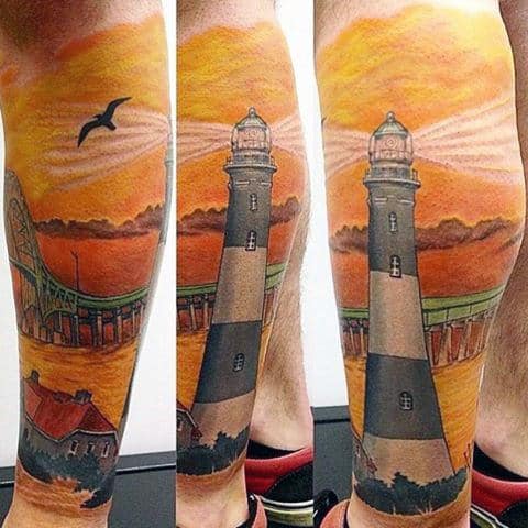 Male Lighthouse At Sunset Tattoo On Calf Brightly Colored