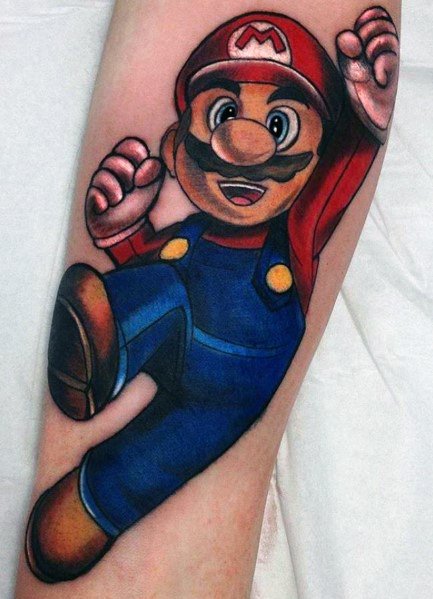 Bold and colorful *Super Mario* tattoo featuring dynamic shading and vibrant details, capturing Mario mid-jump in a classic action pose.