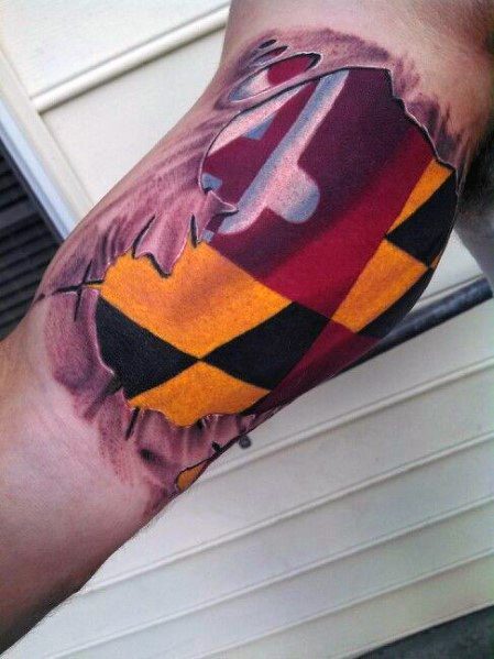 Maryland flag tattoo with a torn skin effect on the arm, creating a bold 3D illusion as if the flag is beneath the skin.