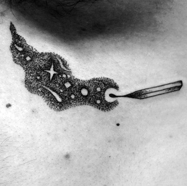 Dotwork tattoo of a matchstick releasing cosmic smoke filled with stars and planets, symbolizing imagination, wonder, and the spark of the universe.