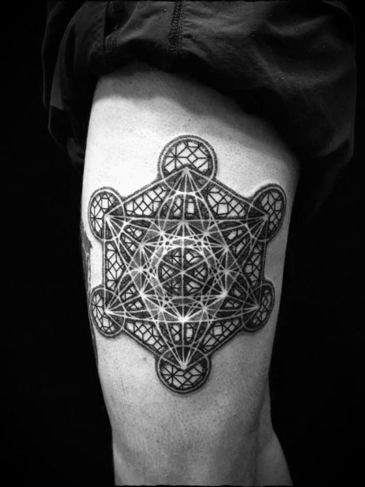 Thigh tattoo of Metatron’s Cube with bold black lines, intricate inner detailing, and layered geometry for a powerful and complex design.