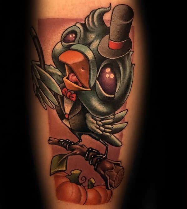 Tattoo of a whimsical magician bird in a top hat and bowtie perched on a branch, with pumpkins below