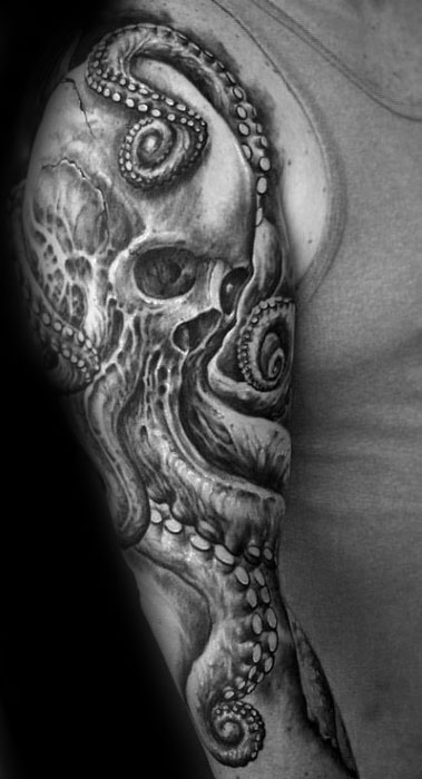 Skull surrounded by octopus tentacles, with intricate shading and detailed line work, creating a bold, dramatic black-and-grey design.