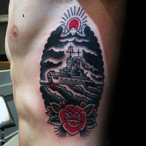 Battleship tattoo sailing with clouds, a red sun, and a rose on a person's side