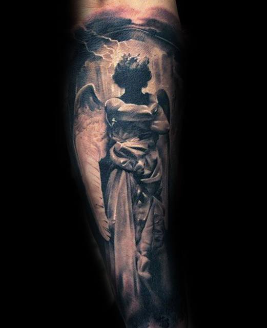 A black and grey tattoo on the forearm depicting a silhouetted angel with large wings, set against a dramatic stormy sky with lightning.