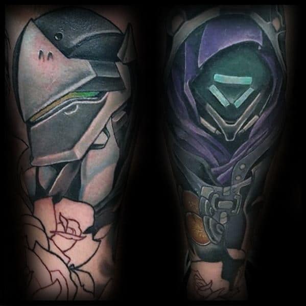 Bold forearm tattoo featuring Genji and Reaper from Overwatch, detailed with sharp shading and contrasting color palettes.