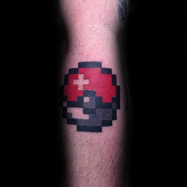 Retro-style Pokeball tattoo with an 8-bit pixelated design, capturing classic video game nostalgia on the forearm.