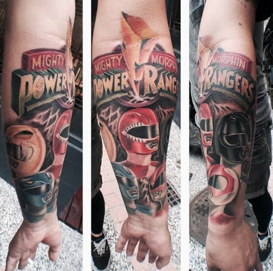 Full forearm tattoo featuring the Mighty Morphin Power Rangers logo with detailed Red, Yellow, and Black Ranger portraits and lightning.