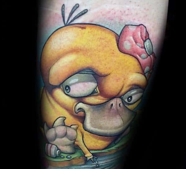 Realistic-style Psyduck tattoo with exaggerated features, detailed shading, and a seashell accessory, inked on a man's forearm.