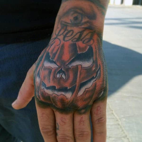 Male Pumpkin Hand Tattoo With White Ink