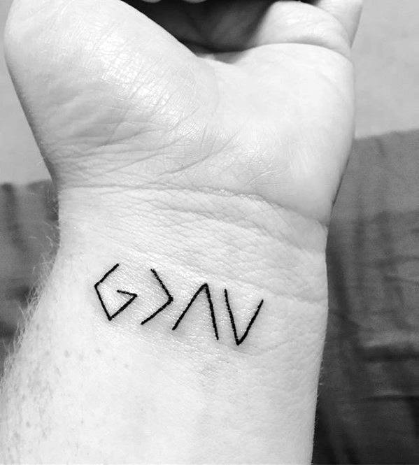 Tattoo on a wrist with symbols G>^V