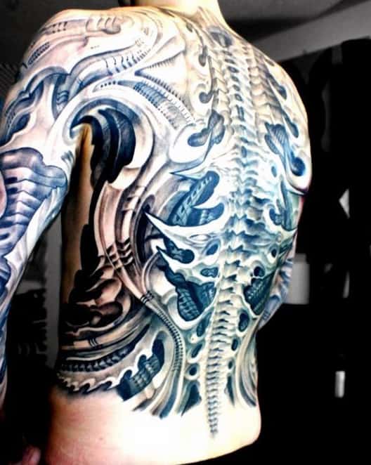 Intricate biomechanical tattoo covering a man's back, featuring a detailed spinal design