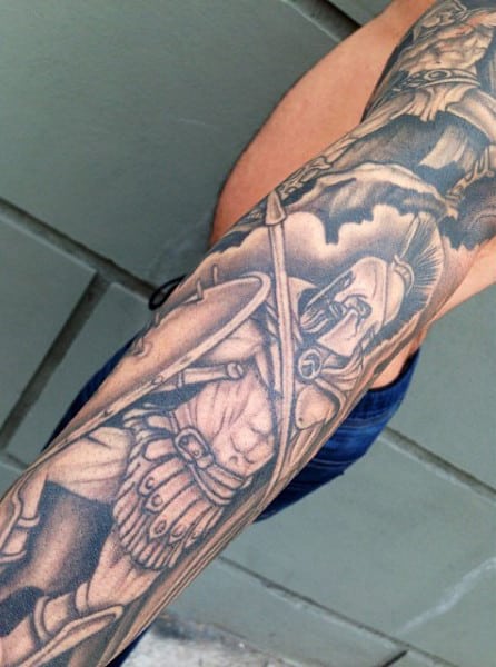 Detailed gladiator warrior tattoo on a person's arm