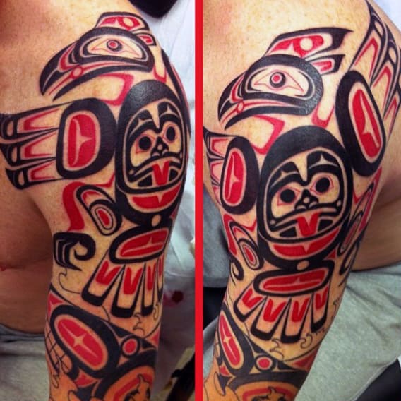 Male Shoulders Dark Red Black Haida Tatto